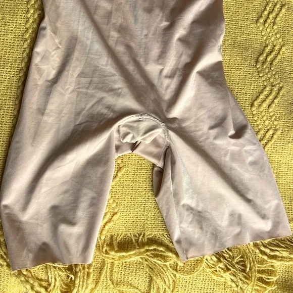 SPANX suit your fancy body suit.